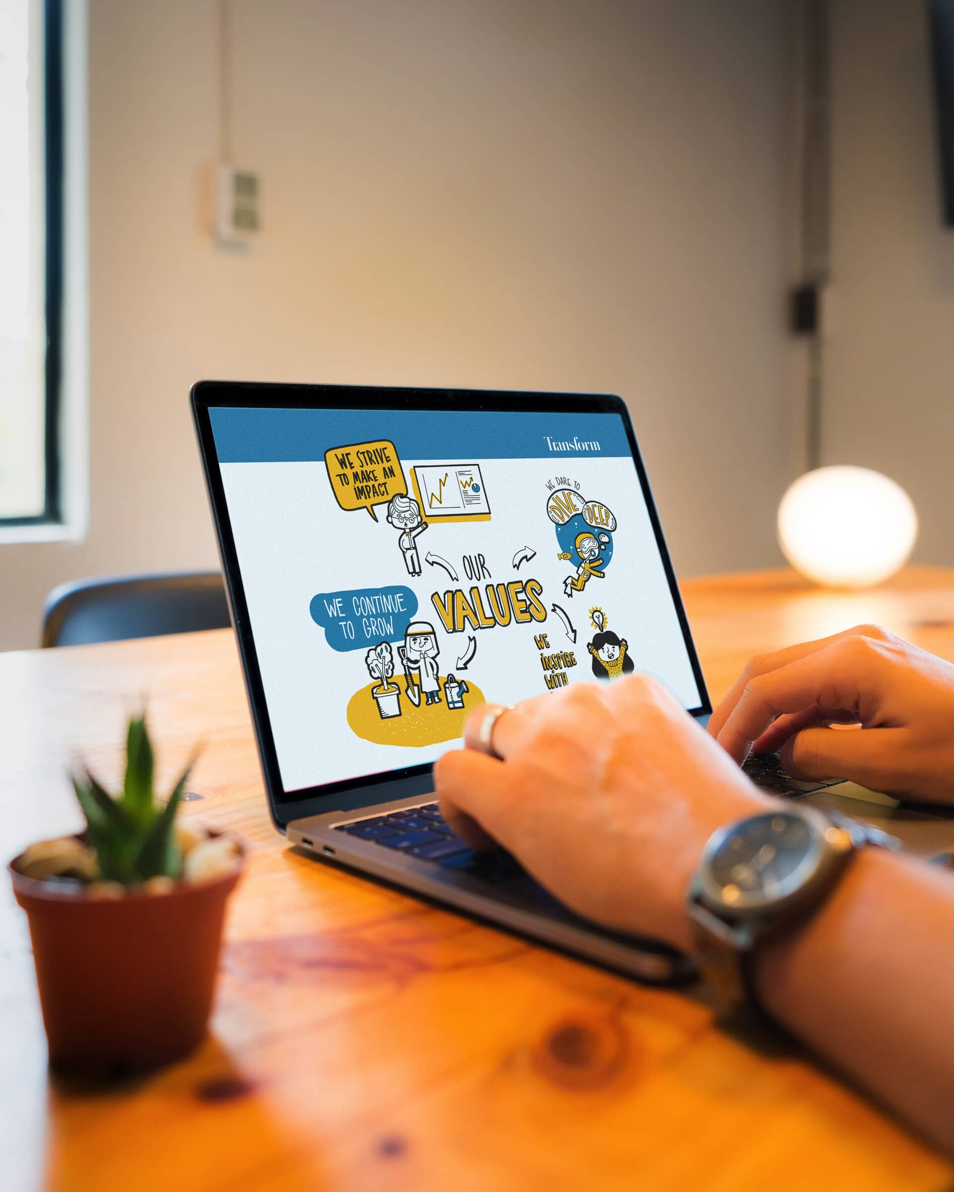 Transform's illustrated Values slide displayed on a laptop computer